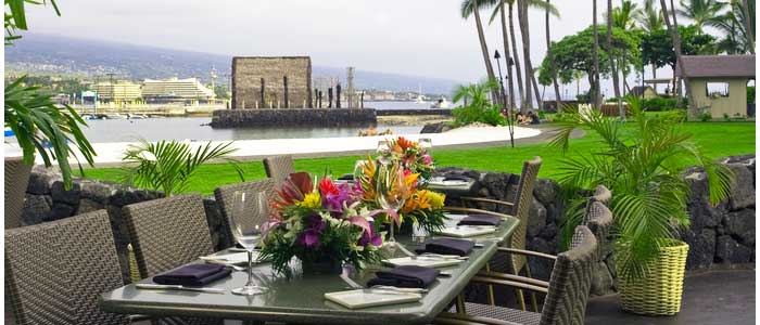 A table with flowers and plates on it