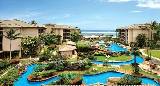 A resort with pools and water slides on the beach.